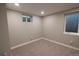 Carpeted room with a window and baseboard trim, offering potential as a bedroom or office at 7600 S Ulster Ct, Centennial, CO 80112