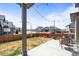 Spacious backyard with a patio, perfect for outdoor dining and entertaining guests in a serene setting at 1624 Pinion Wing Cir, Castle Rock, CO 80108