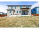 A level backyard featuring a covered patio, perfect for outdoor relaxation and entertaining at 1624 Pinion Wing Cir, Castle Rock, CO 80108