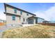 Large backyard showing the home's windows, patio and lawn at 1624 Pinion Wing Cir, Castle Rock, CO 80108