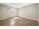 The basement features vinyl floors with a window and a light paint creating a bright and spacious area at 1624 Pinion Wing Cir, Castle Rock, CO 80108