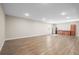 Spacious basement featuring bright lighting, wood-look floors and a wet bar, perfect for entertaining at 1624 Pinion Wing Cir, Castle Rock, CO 80108