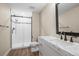 Updated bathroom featuring shower with glass door, decorative backsplash and marble countertop and backsplash at 1624 Pinion Wing Cir, Castle Rock, CO 80108