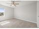 Comfortable bedroom with carpeting and a window offering natural light at 1624 Pinion Wing Cir, Castle Rock, CO 80108