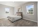 Neutral bedroom features a picture window, a cow art piece, and cozy carpet at 1624 Pinion Wing Cir, Castle Rock, CO 80108