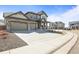 Beautiful two-story home featuring a wide driveway and meticulously maintained landscaping at 1624 Pinion Wing Cir, Castle Rock, CO 80108