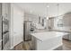 Modern kitchen featuring a large island, stainless steel appliances, and grey cabinetry at 1624 Pinion Wing Cir, Castle Rock, CO 80108