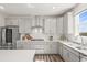 Charming kitchen featuring stainless steel appliances, white countertops, and ample cabinet space for all your culinary needs at 1624 Pinion Wing Cir, Castle Rock, CO 80108