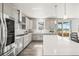 Bright, modern kitchen with stainless steel appliances, quartz countertops, and plenty of cabinet space for storage at 1624 Pinion Wing Cir, Castle Rock, CO 80108