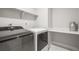 Laundry room with washer, dryer, and open shelves, for easy organization at 1624 Pinion Wing Cir, Castle Rock, CO 80108