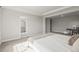 Well-lit main bedroom shows ensuite access and sitting area with desk at 1624 Pinion Wing Cir, Castle Rock, CO 80108