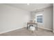Office features neutral carpet, a picture window, and desk at 1624 Pinion Wing Cir, Castle Rock, CO 80108