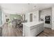 Beautiful open-concept layout seamlessly connecting the kitchen, dining, and living areas at 1624 Pinion Wing Cir, Castle Rock, CO 80108