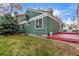 Back exterior of home with a deck and lawn at 2675 S Deframe Cir, Lakewood, CO 80228