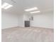 Finished basement space with neutral carpet and recessed lighting at 2675 S Deframe Cir, Lakewood, CO 80228