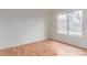 Bedroom with hardwood floors and natural light from the window at 2675 S Deframe Cir, Lakewood, CO 80228