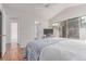 Bedroom with vaulted ceilings, hardwood floors, and ensuite bathroom access at 2675 S Deframe Cir, Lakewood, CO 80228