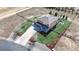 Beautiful aerial view of home with large yard, fire pit, landscaping and a long driveway at 12701 Strawberry Cir, Longmont, CO 80503