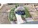 Aerial view of a home on a large lot with mature landscaping, circular driveway, and fencing at 12701 Strawberry Cir, Longmont, CO 80503