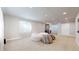 Spacious finished basement with a wet bar and recessed lighting and comfortable bean bag chairs at 12701 Strawberry Cir, Longmont, CO 80503