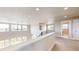 Open hallway with views to the lower level and outdoor space at 12701 Strawberry Cir, Longmont, CO 80503