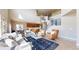 Open-concept living area featuring soaring ceilings and a modern staircase at 12701 Strawberry Cir, Longmont, CO 80503