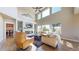 Bright and open living room featuring a modern fireplace and large windows at 12701 Strawberry Cir, Longmont, CO 80503