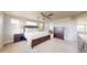 Spacious main bedroom featuring an ensuite bathroom, windows for natural light, and ample closet space at 12701 Strawberry Cir, Longmont, CO 80503