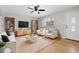 Bright living room with hardwood floors and stylish furnishings at 10913 W 67Th Pl, Arvada, CO 80004