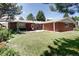 Expansive backyard with a covered patio and ample space for outdoor enjoyment at 2900 S Golden Way, Denver, CO 80227
