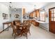 Eat-in kitchen featuring wood cabinets, wood table and chairs and natural light at 2900 S Golden Way, Denver, CO 80227
