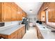 Well-lit kitchen offering abundant cabinet storage, generous counter space, and stainless steel appliances at 2900 S Golden Way, Denver, CO 80227