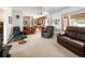Open floor plan featuring a living room with leather seating that opens to the kitchen at 2900 S Golden Way, Denver, CO 80227