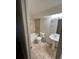 Cozy bathroom boasts tile flooring, a tub, and a pedestal sink for a simple and clean look at 1390 Emerson St # 107, Denver, CO 80218