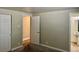 Carpeted bedroom features closet and bathroom access for ease and functionality at 1390 Emerson St # 107, Denver, CO 80218