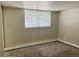 Neutral bedroom features ample natural light, and comfortable carpet for a cozy atmosphere at 1390 Emerson St # 107, Denver, CO 80218