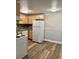 Well-lit kitchen features efficient appliances, ample counter space, and durable flooring at 1390 Emerson St # 107, Denver, CO 80218