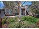 Landscaped backyard with lush green grass, mature trees, and a covered patio area, perfect for relaxing outdoors at 11788 Mill Valley St, Parker, CO 80138