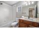 Bright bathroom featuring shower-tub combination and granite countertop vanity at 11788 Mill Valley St, Parker, CO 80138