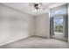 Bedroom with large window, carpet and ceiling fan at 11788 Mill Valley St, Parker, CO 80138