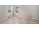 Bright bedroom with light hardwood floors and natural light from two windows at 11788 Mill Valley St, Parker, CO 80138