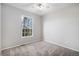 Carpeted bedroom with a ceiling fan and a view to the outside through a window at 11788 Mill Valley St, Parker, CO 80138