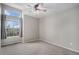 Bedroom featuring a window with curtains and ceiling fan with overhead lighting at 11788 Mill Valley St, Parker, CO 80138
