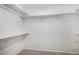 A well-organized walk-in closet offers ample storage with multiple shelves and hanging rods at 11788 Mill Valley St, Parker, CO 80138