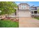 Charming two-story home features a stone accent porch and a spacious two-car garage at 11788 Mill Valley St, Parker, CO 80138
