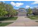 Charming two-story home featuring stone accents, a well-maintained lawn, and an attached two-car garage at 11788 Mill Valley St, Parker, CO 80138