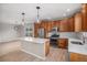 Modern kitchen featuring stainless steel appliances, a center island, and an open layout at 11788 Mill Valley St, Parker, CO 80138