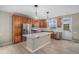 Modern kitchen with stainless steel appliances, a center island, and ample cabinet space for storage at 11788 Mill Valley St, Parker, CO 80138