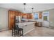 Beautiful kitchen featuring stainless steel appliances, custom cabinets, and a central island with barstool seating at 11788 Mill Valley St, Parker, CO 80138