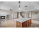 Spacious living room with a fireplace, hardwood floors, and an open layout at 11788 Mill Valley St, Parker, CO 80138